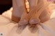 A close up of a person's feet on a bed.