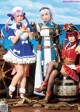 A group of three women dressed in sailor outfits posing for a picture.